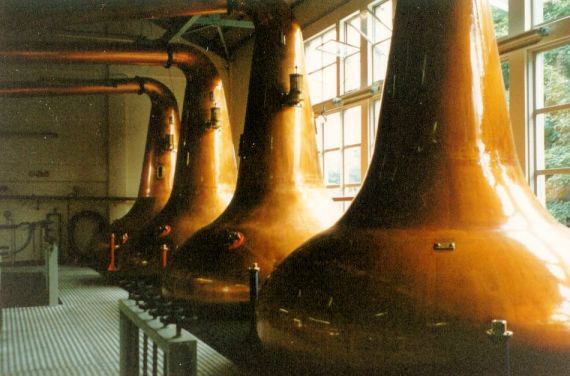 The copper stills in the Glen Ord whisky distillery at Muir of Ord near Inverness.